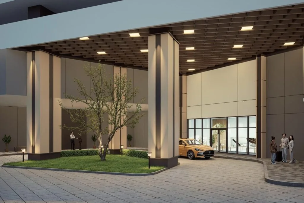 Driveway access to Tower D2 lower ground drop-off lobby at Causewayz Square @ JBCC by EXSIM, framed by landscaped greenery and warm lighting.