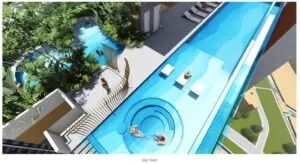 Aerial view of sky roof swimming and leisure area at Axis Tower, Causewayz Square @ JBCC, highlighting the wave pool, lounge deck, and nature garden within the exsim ciq lifestyle facilities.