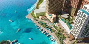 Aerial view of The Bedrock @ Jesselton Docklands with marina, waterfront boulevard, and integrated podium lifestyle facilities by EXSIM Sabah