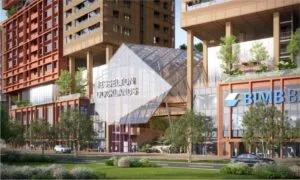 Main entrance of Jesselton Docklands with architectural glass facade and signage, located at EXSIM Sabah's waterfront development.