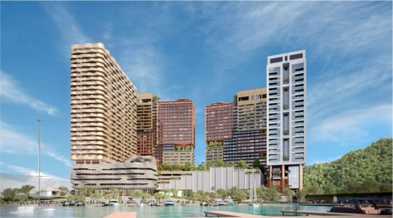 Seafront view of The Bedrock @ Jesselton Docklands by EXSIM Sabah, showing the full waterfront development against a backdrop of the South China Sea.