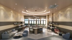 Co-working space at Erinaz Suites @ Kubang Kerian featuring shared work desks, lounge seating, natural lighting and comfortable study environment for residents.