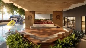 Courtyard garden at Erinaz Suites by EXSIM with landscaped greenery, shaded seating area and children-friendly water play zone within the residential facilities.