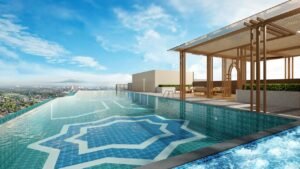 Infinity-style rooftop pool at Erinaz Suites by EXSIM overlooking the surrounding Kubang Kerian skyline, designed for leisure and lifestyle living.