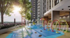 Children water play area at Erinaz Suites @ Kubang Kerian featuring splash fountains, water arches and landscaped outdoor family facilities.