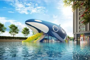 Whale-themed water playground at Erinaz Suites by EXSIM with slide, splash pool and playful outdoor activity space for children.