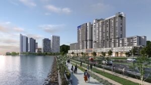 Wide angle view of Keeperz Suites Penang along coastal boulevard with pedestrian walkway, cycling lane and waterfront living environment by exsim penang.