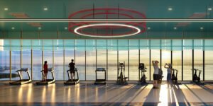 Horizon gym at Keeperz Suites Penang with full-height glass windows offering sea view fitness experience in a penang seafront condo.
