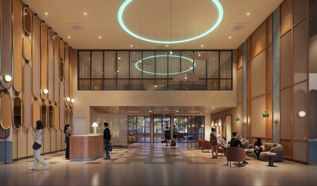 Lobby area at Keeperz Suites Penang featuring high ceiling design, reception counter and premium hospitality-inspired interior space.