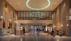 Lobby area at Keeperz Suites Penang featuring high ceiling design, reception counter and premium hospitality-inspired interior space.