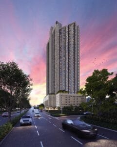 The Lighthauz Residences in Penang by EXSIM featuring a modern high-rise tower facade at sunset, with sleek architectural lines above a multi-level podium, strategically located near George Town and key highways, representing a premium penang seafront condo lifestyle and investment opportunity.