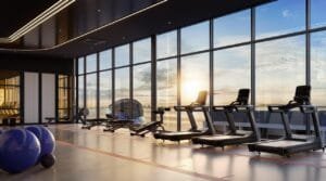 Modern gym facility at The Lighthauz Residences Penang featuring sea-facing floor-to-ceiling windows, premium fitness equipment and natural daylight, offering a wellness-focused lifestyle within this penang seafront condo development.
