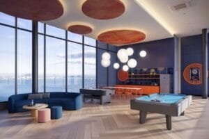Lifestyle entertainment room at The Lighthauz Residences Penang with billiards table, social seating area and panoramic city views, creating a dynamic communal space in this exsim development.