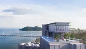 High-level perspective of The Lighthauz Residences rooftop facilities featuring glass pavilion, sky pool and panoramic views of Penang coastline and city skyline, reflecting luxury lifestyle at lighthauz penang.