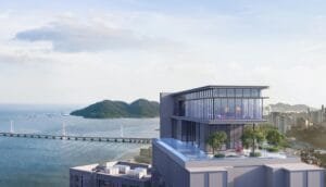Aerial rooftop view of The Lighthauz Residences Penang showcasing sky facilities, infinity pool and landscaped deck overlooking Penang Bridge and coastal skyline, highlighting premium positioning of exsim lighthauz residences.