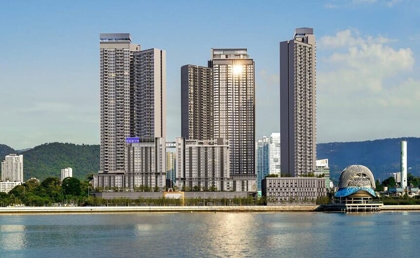 Front aerial view of The Lighthauz Residences Penang showcasing modern high-rise towers along the waterfront with surrounding city skyline and coastal scenery, highlighting its prime penang seafront condo location.