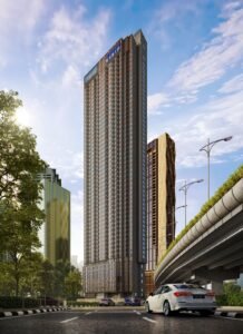 Exterior road view of Phoeniz Suites @ KLCC showing the high-rise tower facade and surrounding Kuala Lumpur city environment.