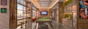 Games Lounge at MABA Suitez with billiards table, bar counter, TV and city-facing windows