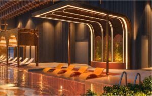 In-water loungers and an illuminated arched canopy at the Sunlit Pool, part of the Tower B sky facilities at MABA Suitez.